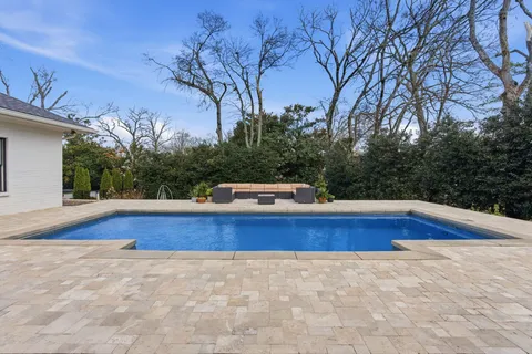 a front view of house with yard and seating area