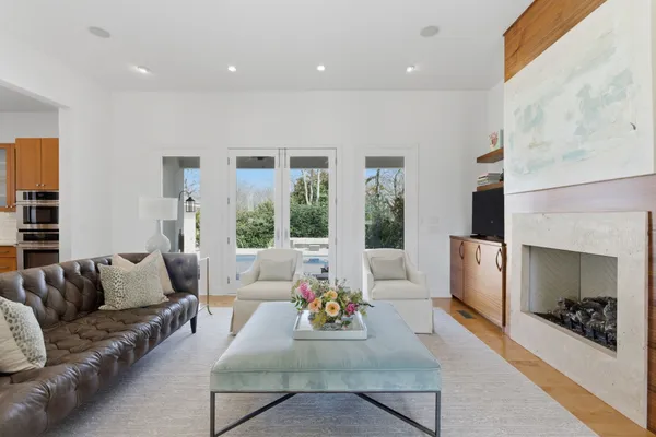 a living room with furniture and a fireplace