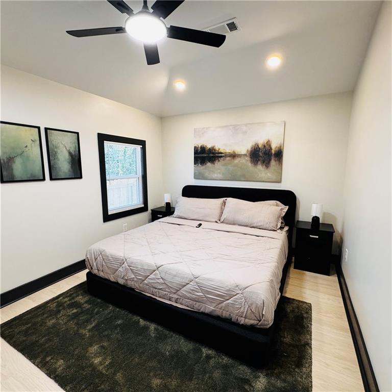 2054 Fargo Place Southeast Atlanta, GA 30316 - Photo 9 of 23 a bed sitting in a bedroom next to a window