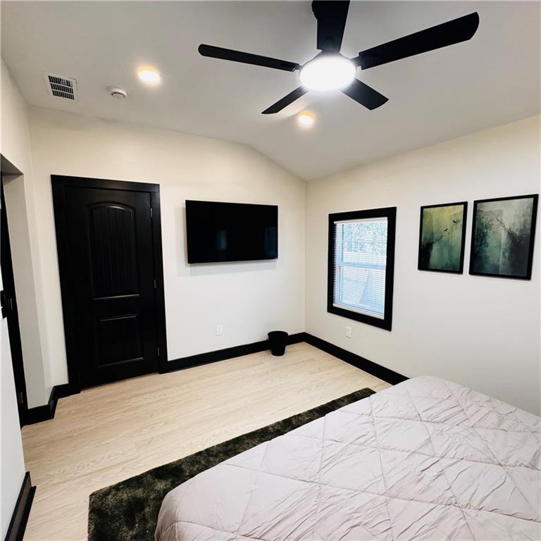 2054 Fargo Place Southeast Atlanta, GA 30316 - Photo 10 of 23 a bedroom with a bed and a flat tv screen