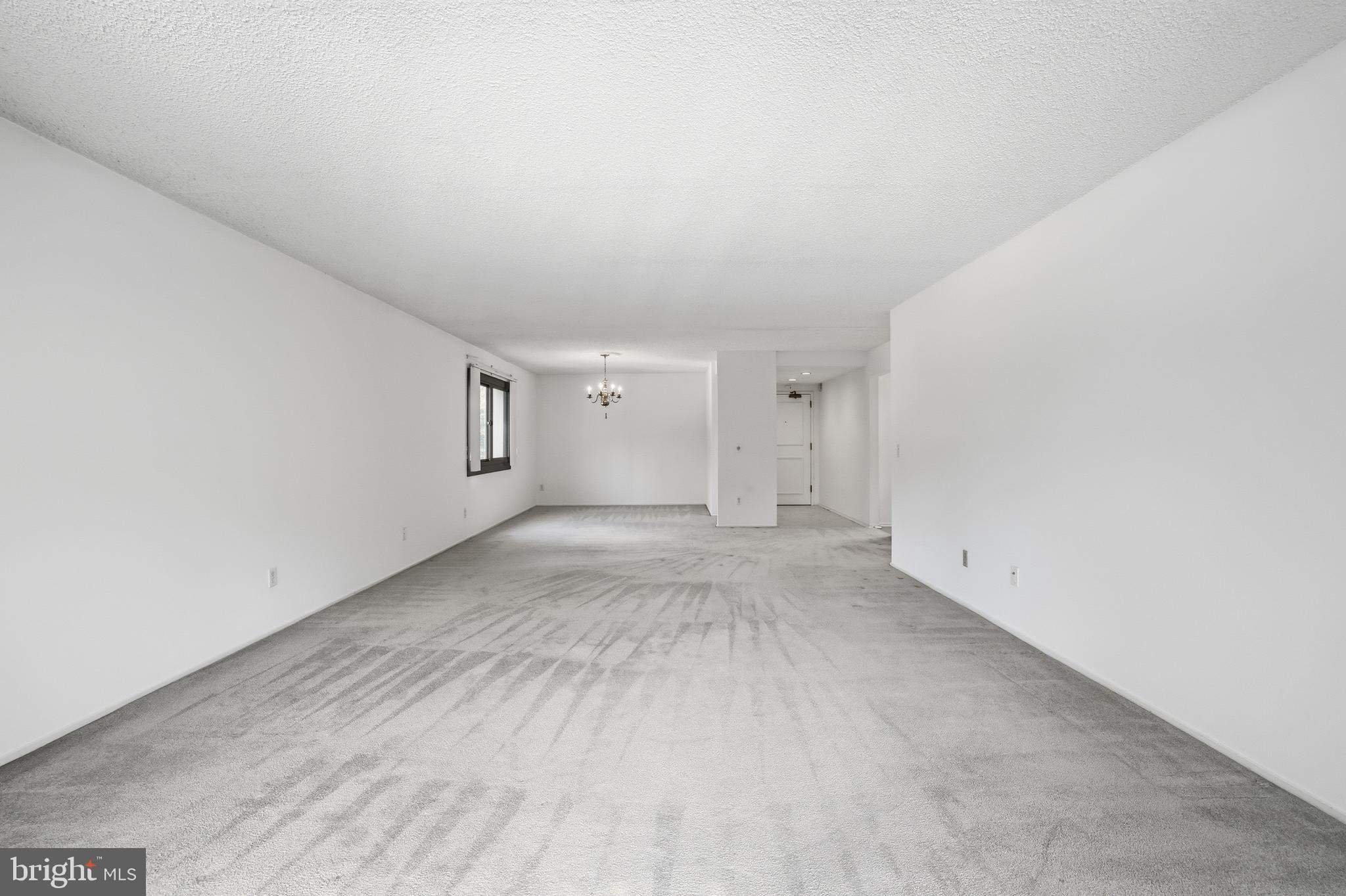 6101 Edsall Road, Unit 502 Alexandria, VA 22304 - Photo 7 of 33 Spacious open-concept living and dining room area