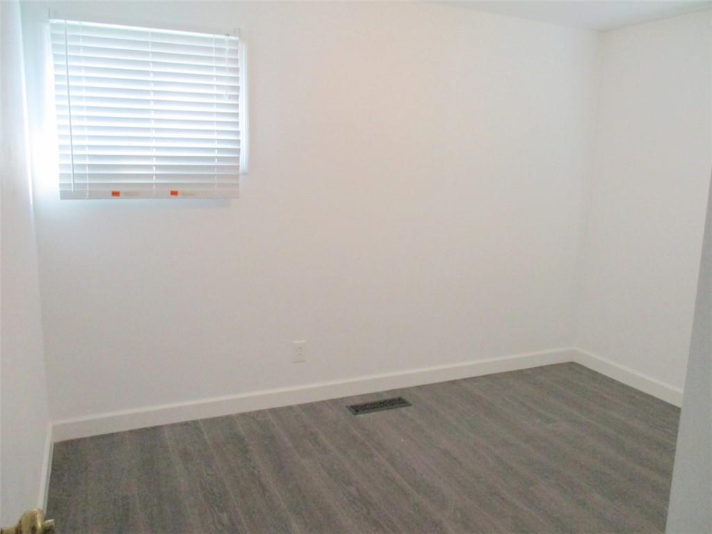 24 Russell Street Baden, PA 15005 - Photo 17 of 31 a view of a small space with wooden floor and a window