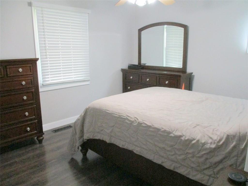 24 Russell Street Baden, PA 15005 - Photo 19 of 31 a bedroom with a bed and a dresser