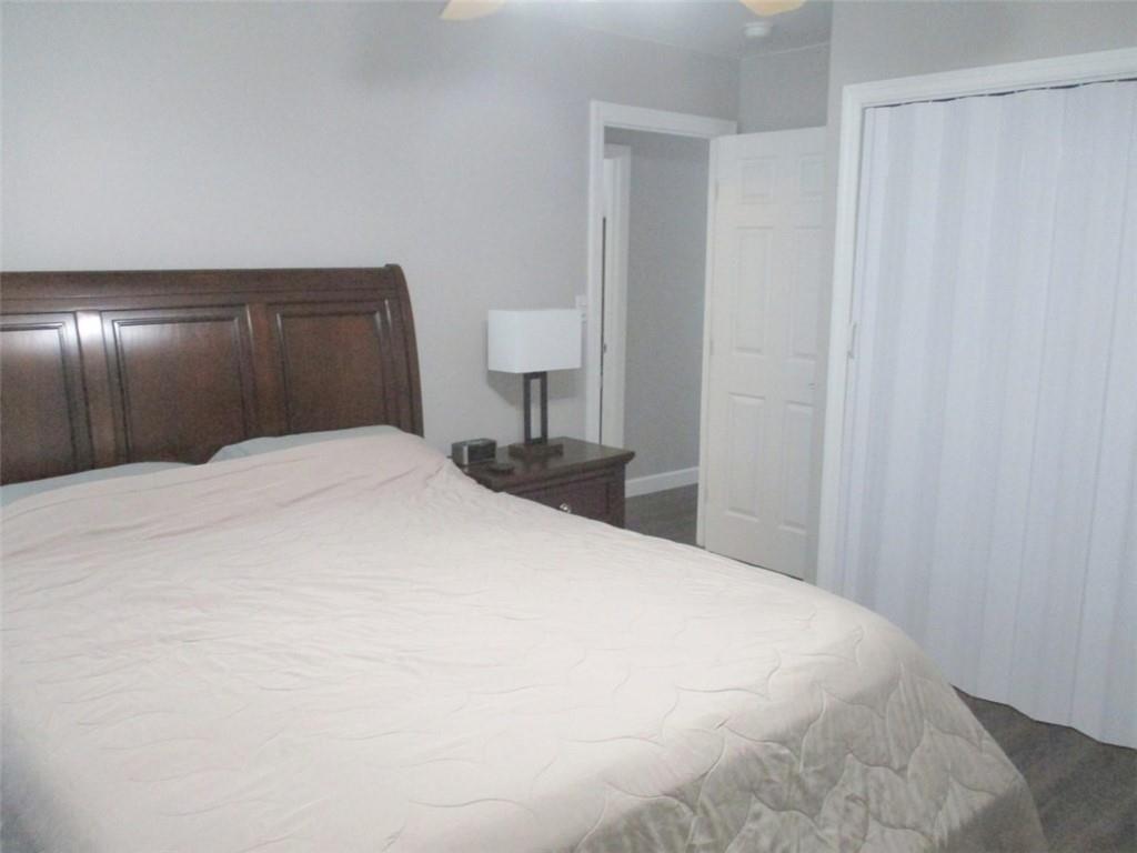 24 Russell Street Baden, PA 15005 - Photo 20 of 31 a large white bed in a white room