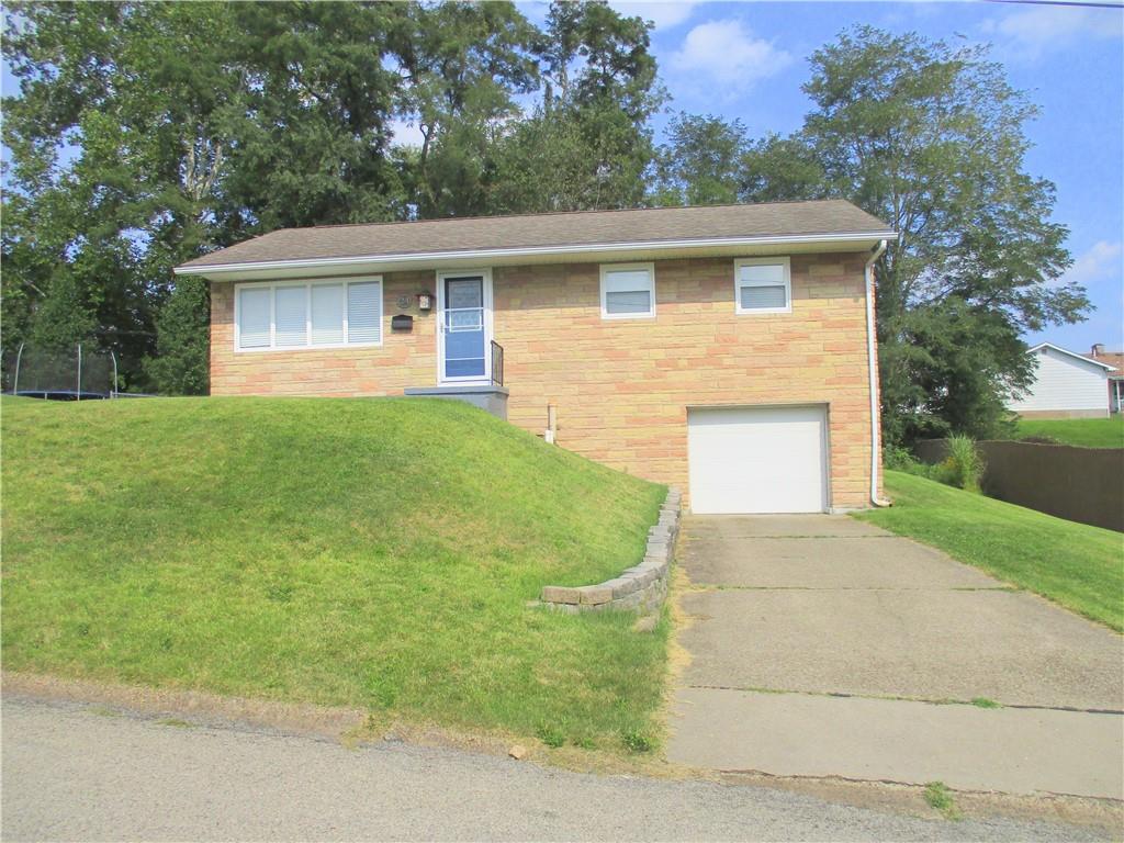 24 Russell Street Baden, PA 15005 - Photo 2 of 31 a front view of house with yard and green space