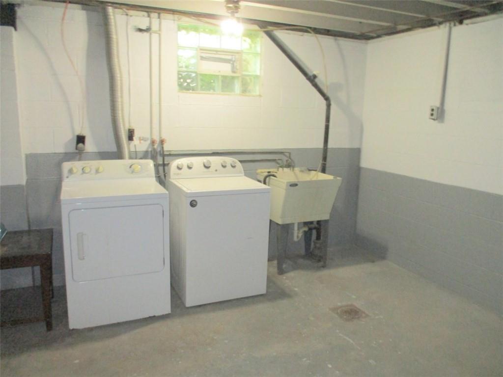 24 Russell Street Baden, PA 15005 - Photo 27 of 31 a utility room with dryer and washer