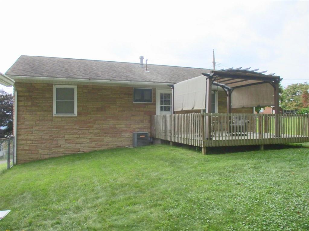 24 Russell Street Baden, PA 15005 - Photo 3 of 31 a front view of a house with yard