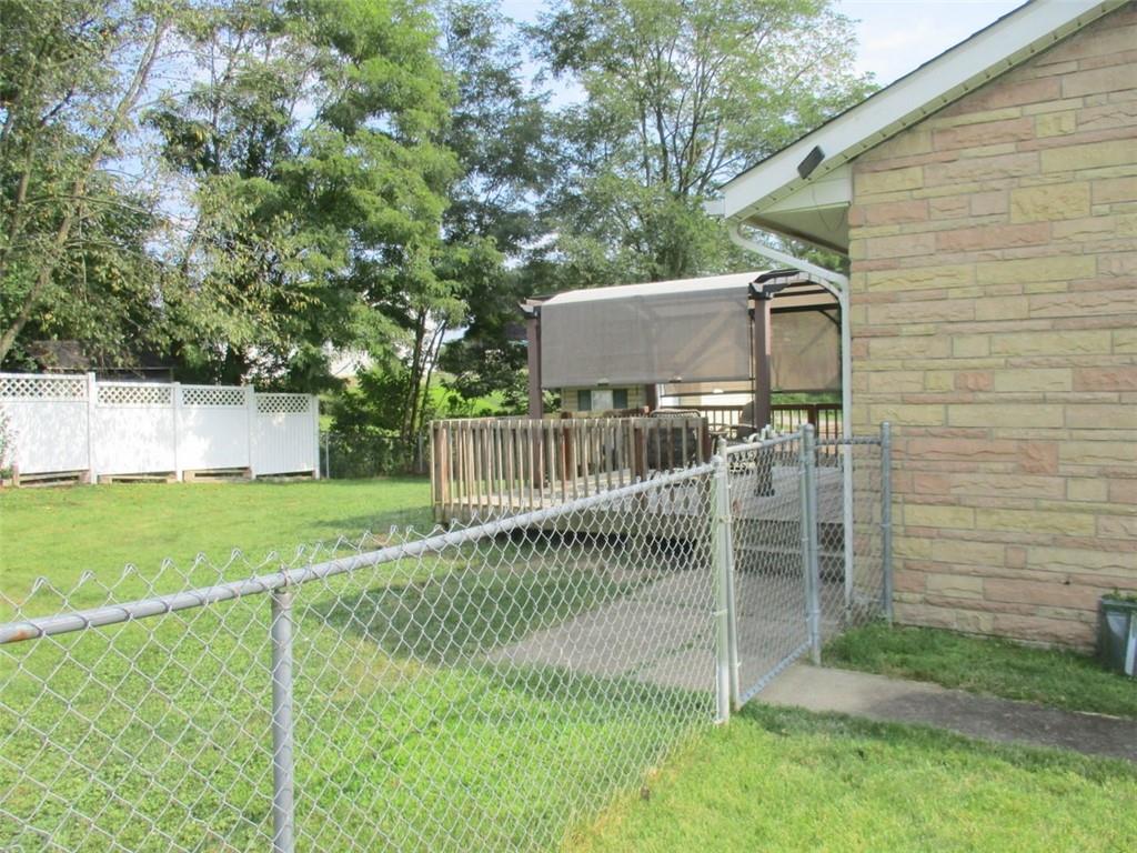 24 Russell Street Baden, PA 15005 - Photo 6 of 31 a view of a house with a fence