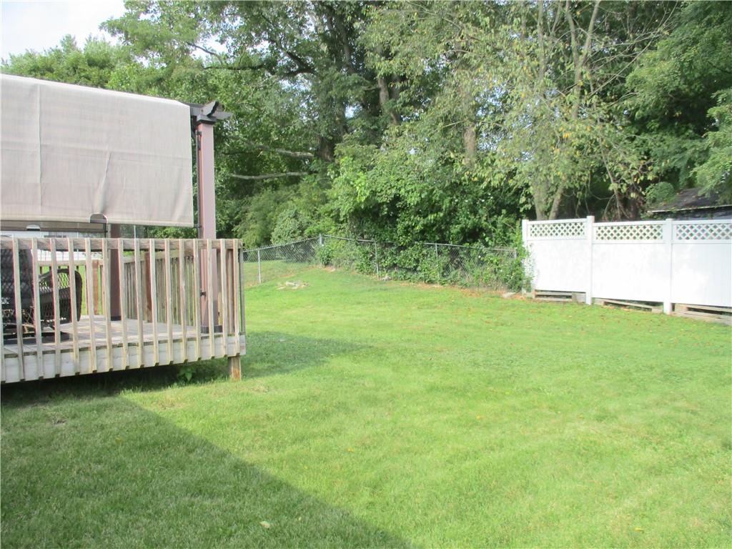 24 Russell Street Baden, PA 15005 - Photo 7 of 31 a view of a chair and yard with a small deck