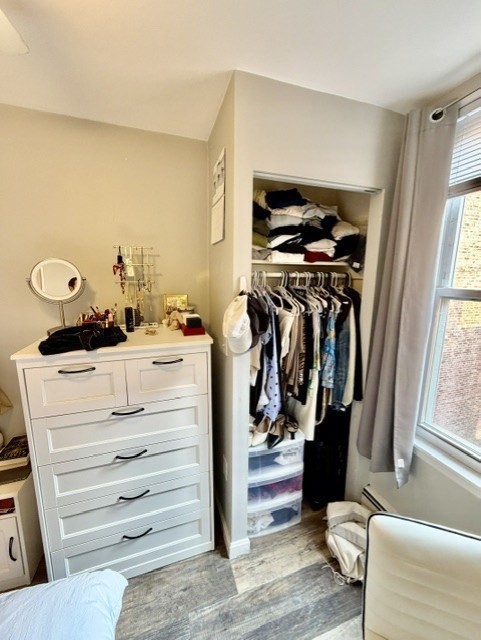 14 Cleveland Place, Unit 3 Boston, MA 02113 - Photo 10 of 22 a view of walk in closet with clothes and shoes