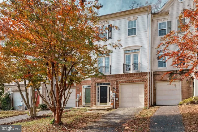 front view of a house with a tree