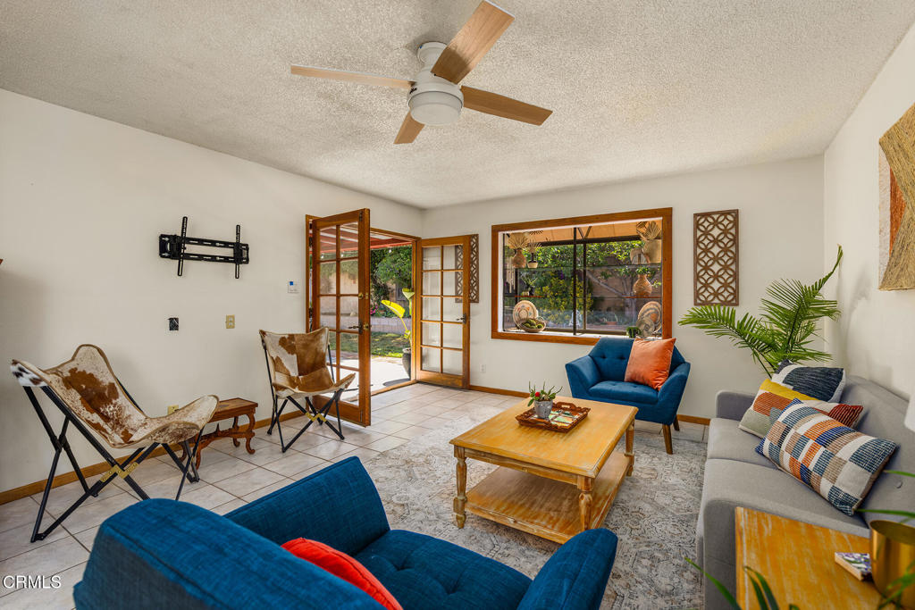 40 Almond Avenue Oak View, CA 93022 - Photo 12 of 30 a living room with furniture fireplace and a large window