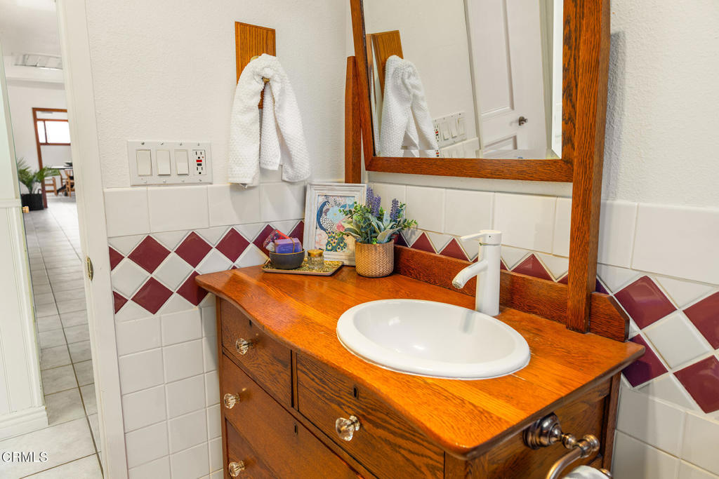 40 Almond Avenue Oak View, CA 93022 - Photo 20 of 30 a bathroom with a sink and a mirror