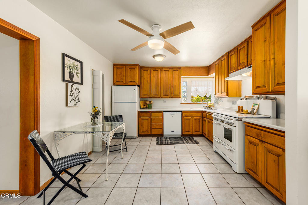 40 Almond Avenue Oak View, CA 93022 - Photo 9 of 30 a kitchen with a sink appliances cabinets and furniture