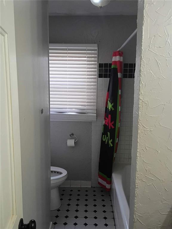 7130 Nantz Road Winston, GA 30187 - Photo 12 of 24 a bathroom with a toilet and shower