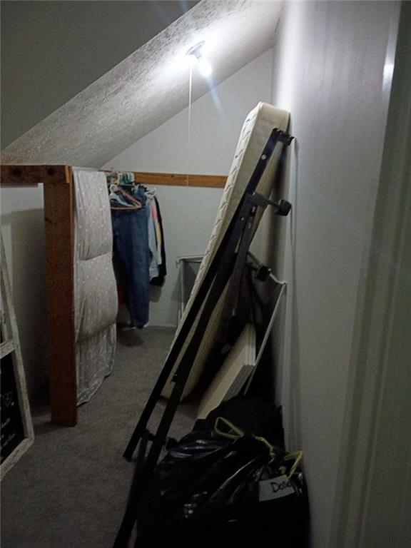 7130 Nantz Road Winston, GA 30187 - Photo 17 of 24 a view of walk in closet with clothes and shoes