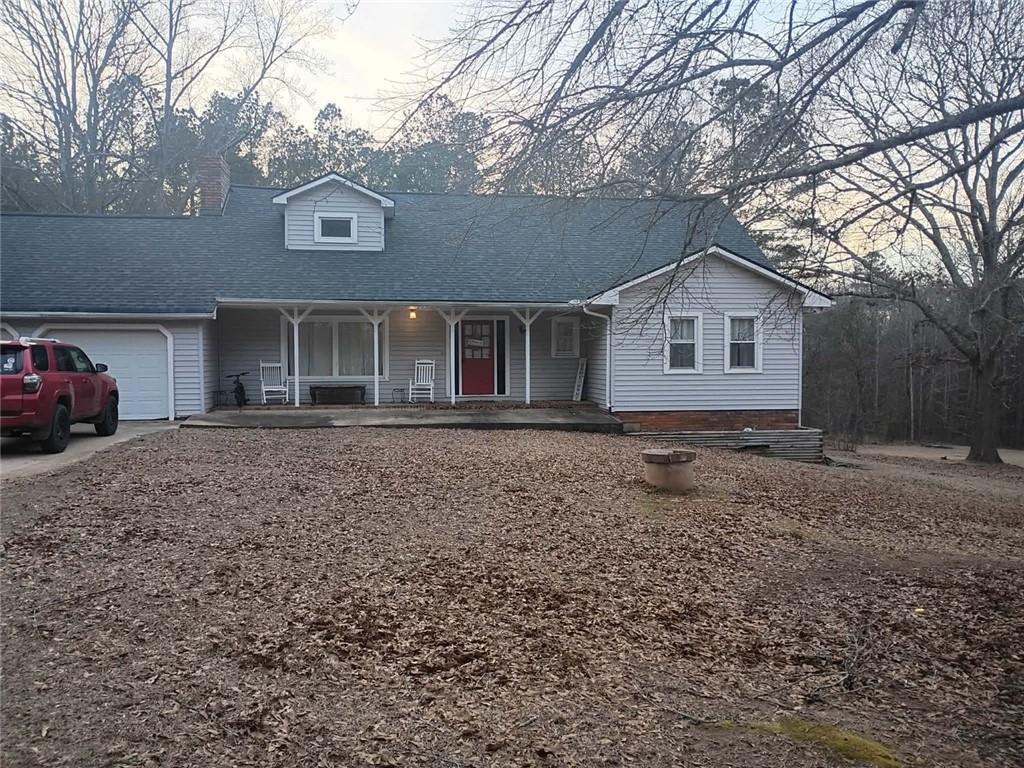 7130 Nantz Road Winston, GA 30187 - Photo 2 of 24 a front view of a house with a garden