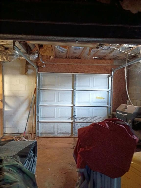 7130 Nantz Road Winston, GA 30187 - Photo 22 of 24 a bed with a black white bedspread and pillows