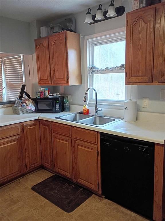 7130 Nantz Road Winston, GA 30187 - Photo 7 of 24 a kitchen with stainless steel appliances granite countertop a sink stove and cabinets