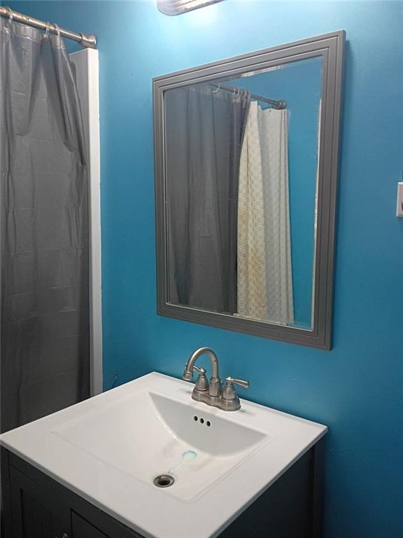 7130 Nantz Road Winston, GA 30187 - Photo 10 of 24 a bathroom with a sink and a mirror