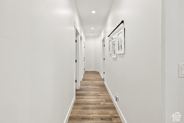 244 East Sevier River Road Central Valley, UT 84754 - Photo 36 of 66 Hallway featuring wood-finish flooring, recessed lighting, and multiple doorways with dark hardware