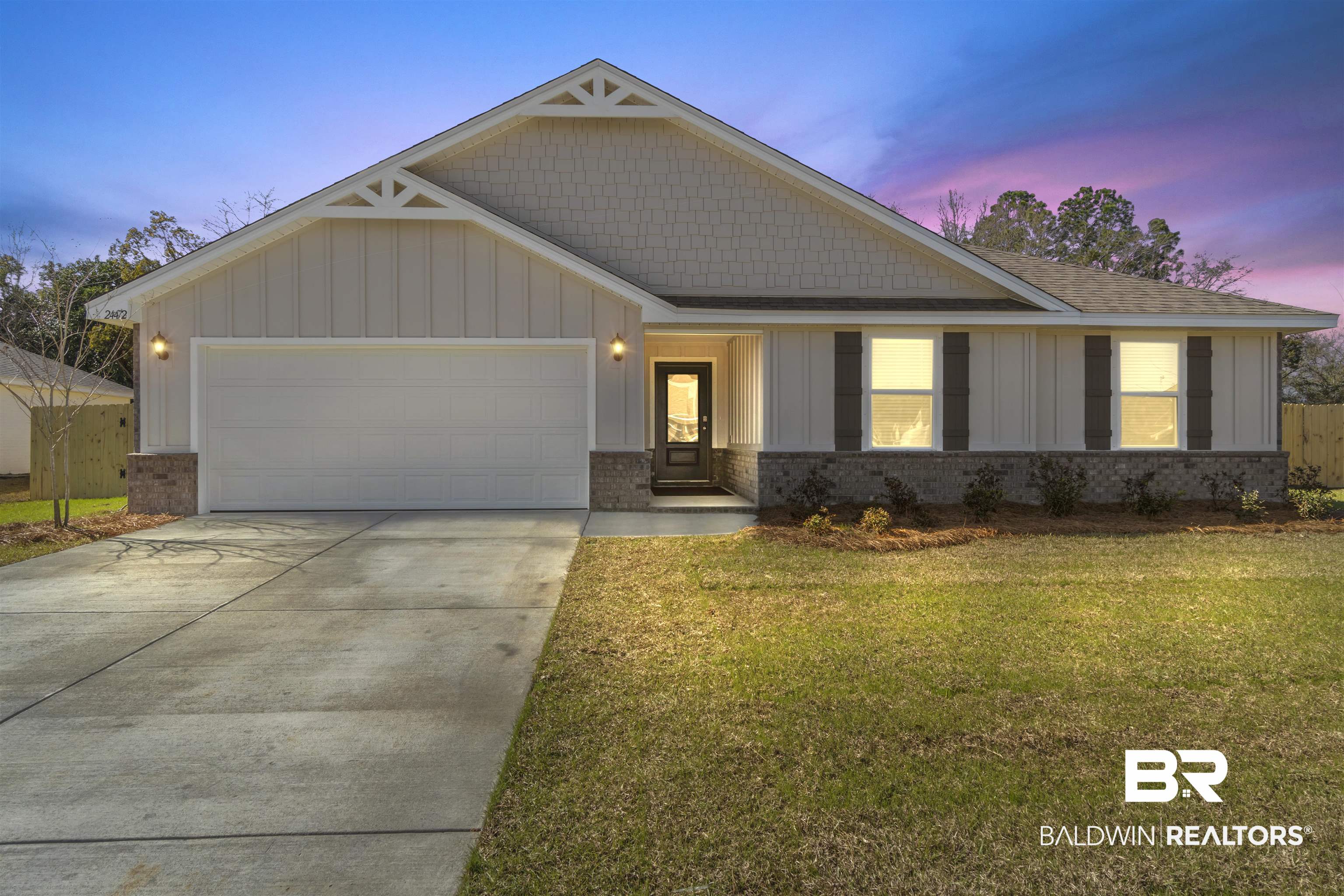 24472 Ringneck Loop Elberta, AL 36530 - Photo 1 of 46 Craftsman inspired home featuring concrete driveway, roof with shingles, an attached garage, a front lawn, and brick siding