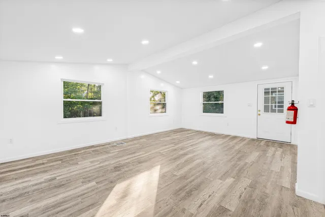 a view of livingroom with hardwood floor and hallway