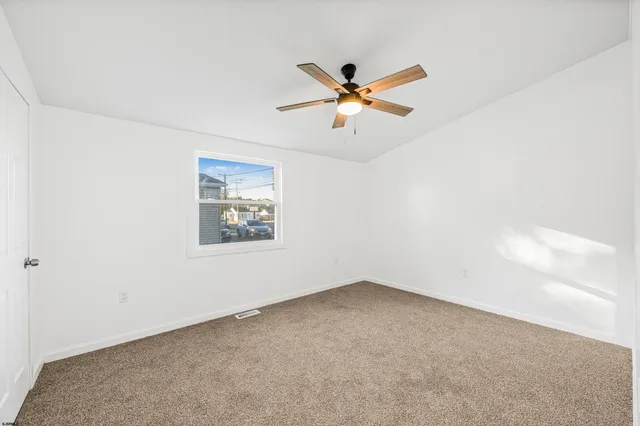 a view of a big room with carpet