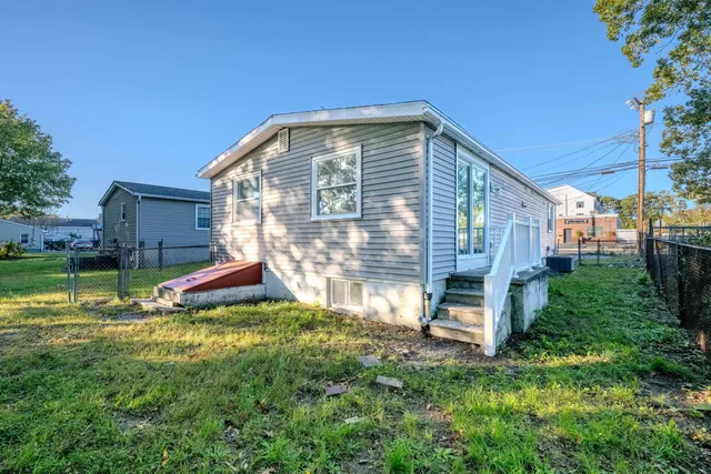 a view of backyard with a garden and plants