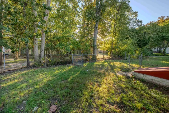 a backyard of a house with lots of green space