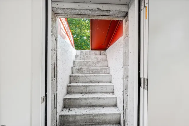 a bathroom with a bathtub and shower