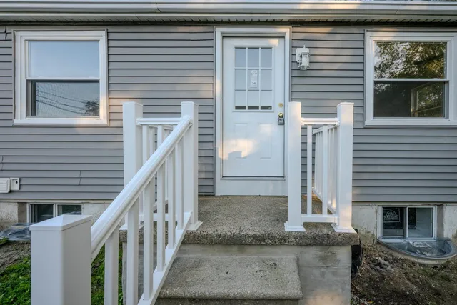 a view of a house with a door and a window