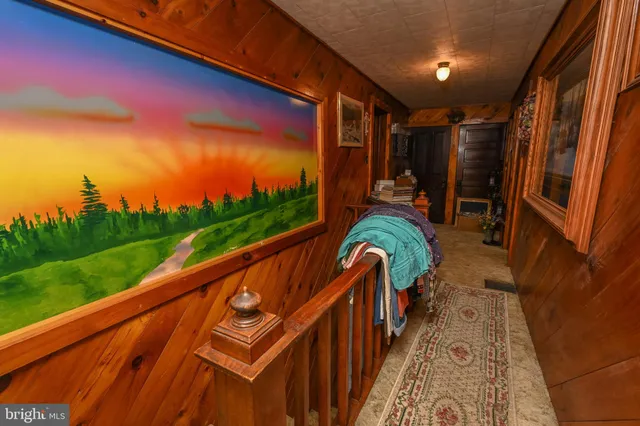 a view of a house with backyard porch and sitting area