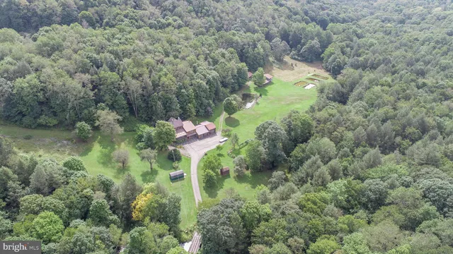 a living room with patio furniture and a floor to ceiling window