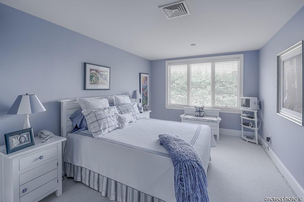 56 The Heights Mashpee, MA 02649 - Photo 13 of 16 a bedroom with a bed and a large window