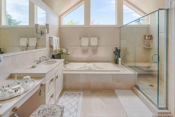 56 The Heights Mashpee, MA 02649 - Photo 16 of 16 a bathroom with a tub sink and mirror