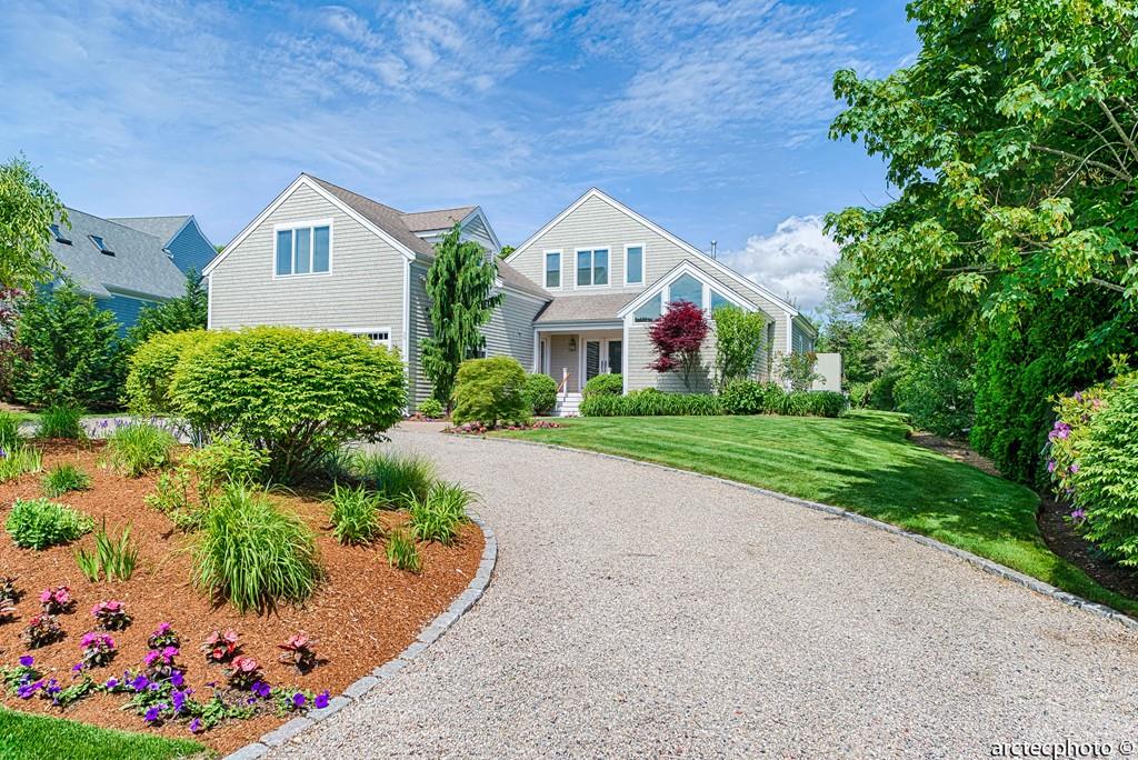56 The Heights Mashpee, MA 02649 - Photo 2 of 16 a house with garden in front of it