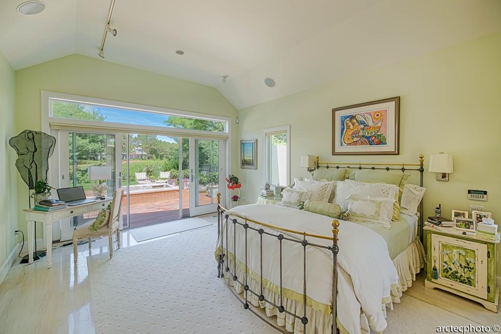 56 The Heights Mashpee, MA 02649 - Photo 4 of 16 a bedroom with a bed and a large window