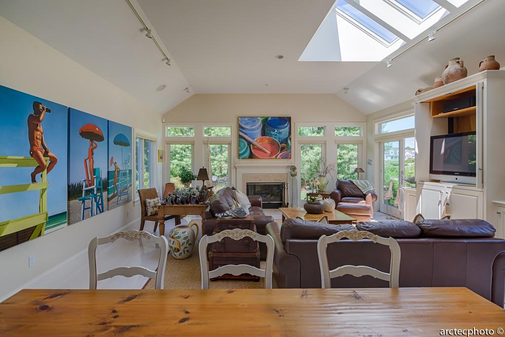 56 The Heights Mashpee, MA 02649 - Photo 6 of 16 a living room with fireplace furniture and a flat screen tv