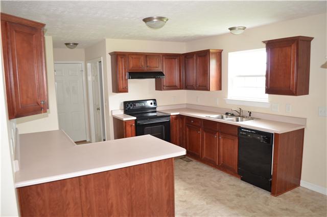 4255 Turnberry Road Lebanon, TN 37090 - Photo 3 of 11 Spacious Kitchen with Cherry Cabinets, Smooth Top Range and Plenty of Counter Space!!