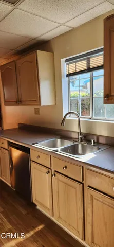 a view of a balcony with wooden floor and windows