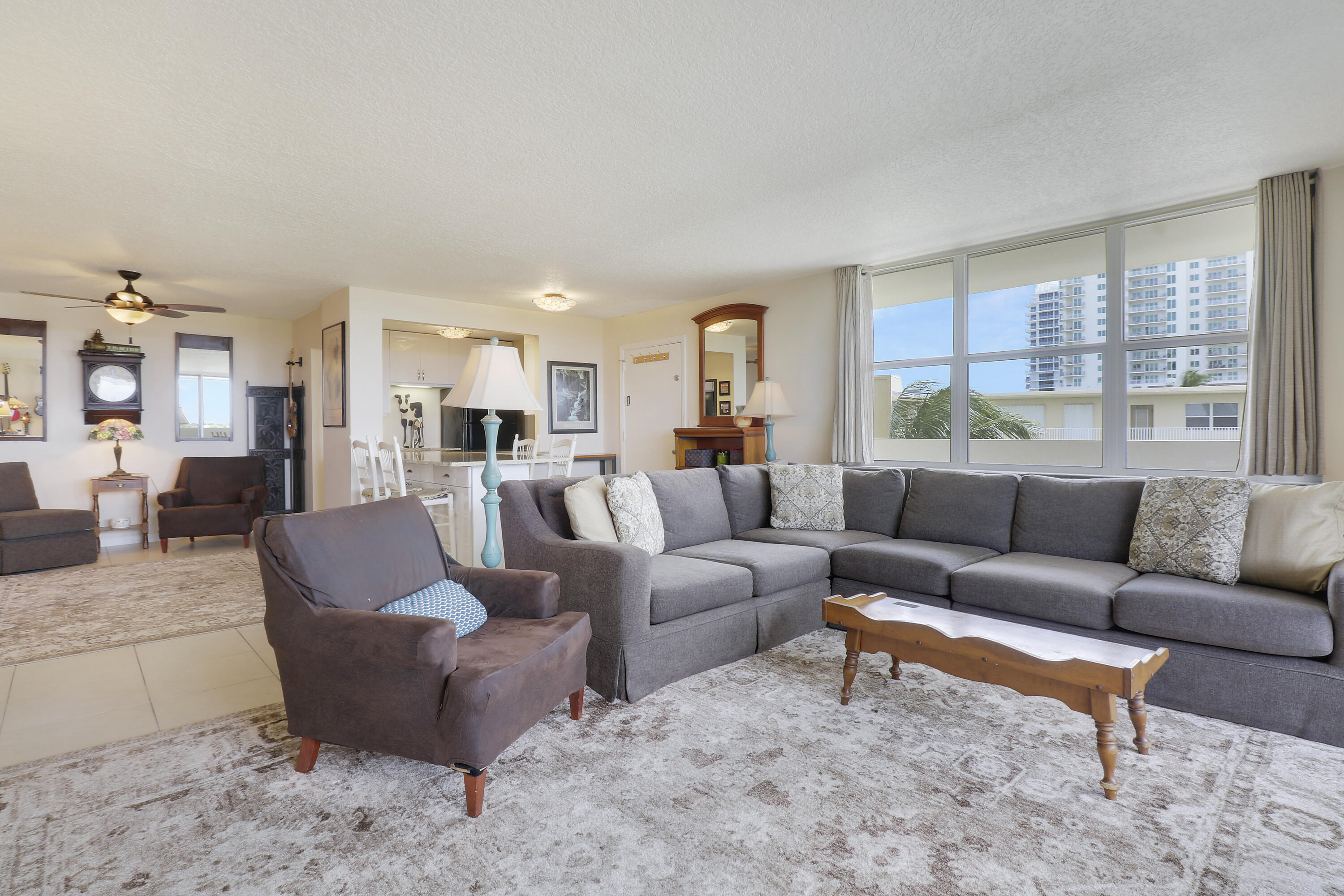 3640 North Ocean Drive, Unit 427 Singer Island, FL 33404 - Photo 12 of 43 a living room with furniture and a large window
