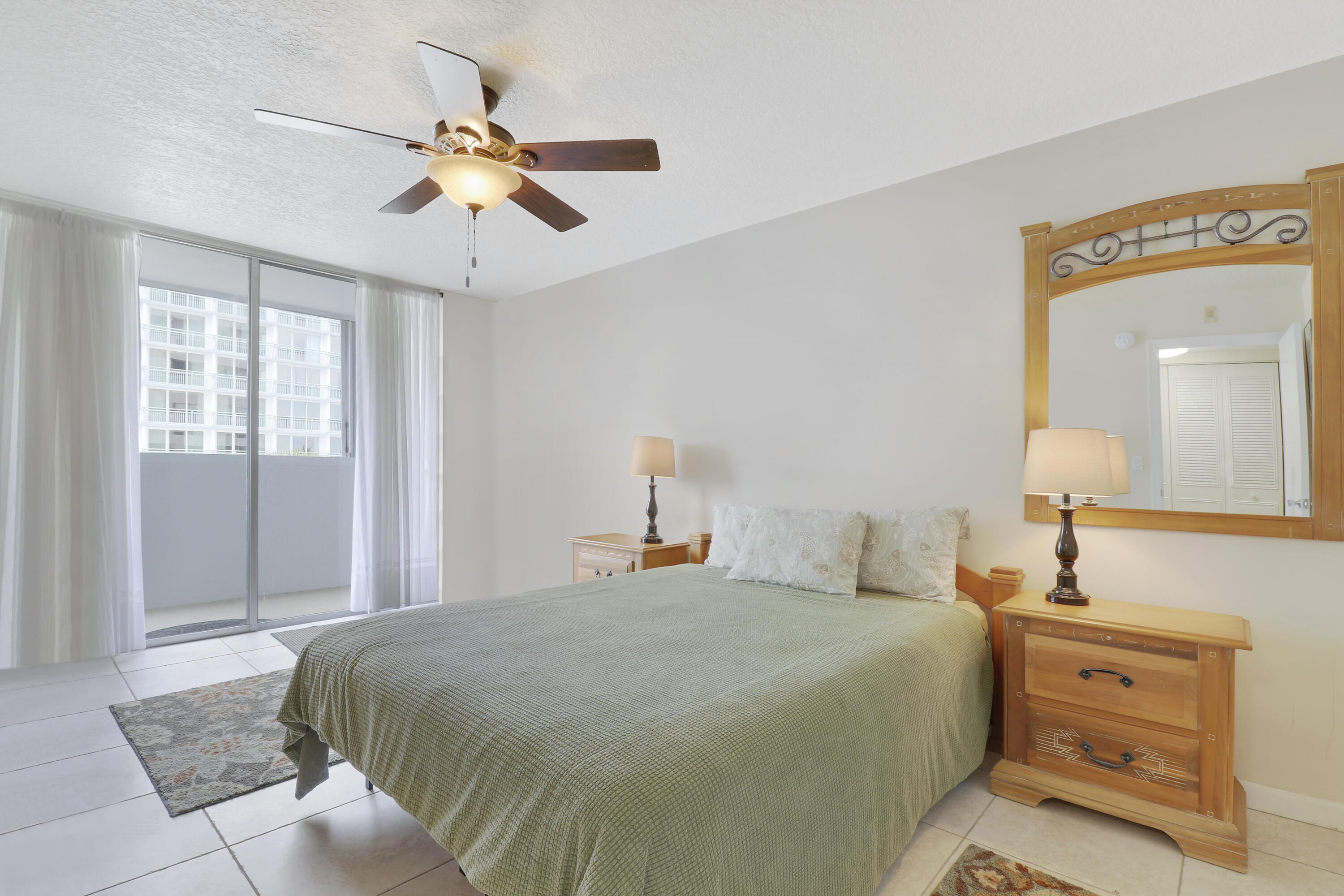 3640 North Ocean Drive, Unit 427 Singer Island, FL 33404 - Photo 20 of 43 a bedroom with a bed and window