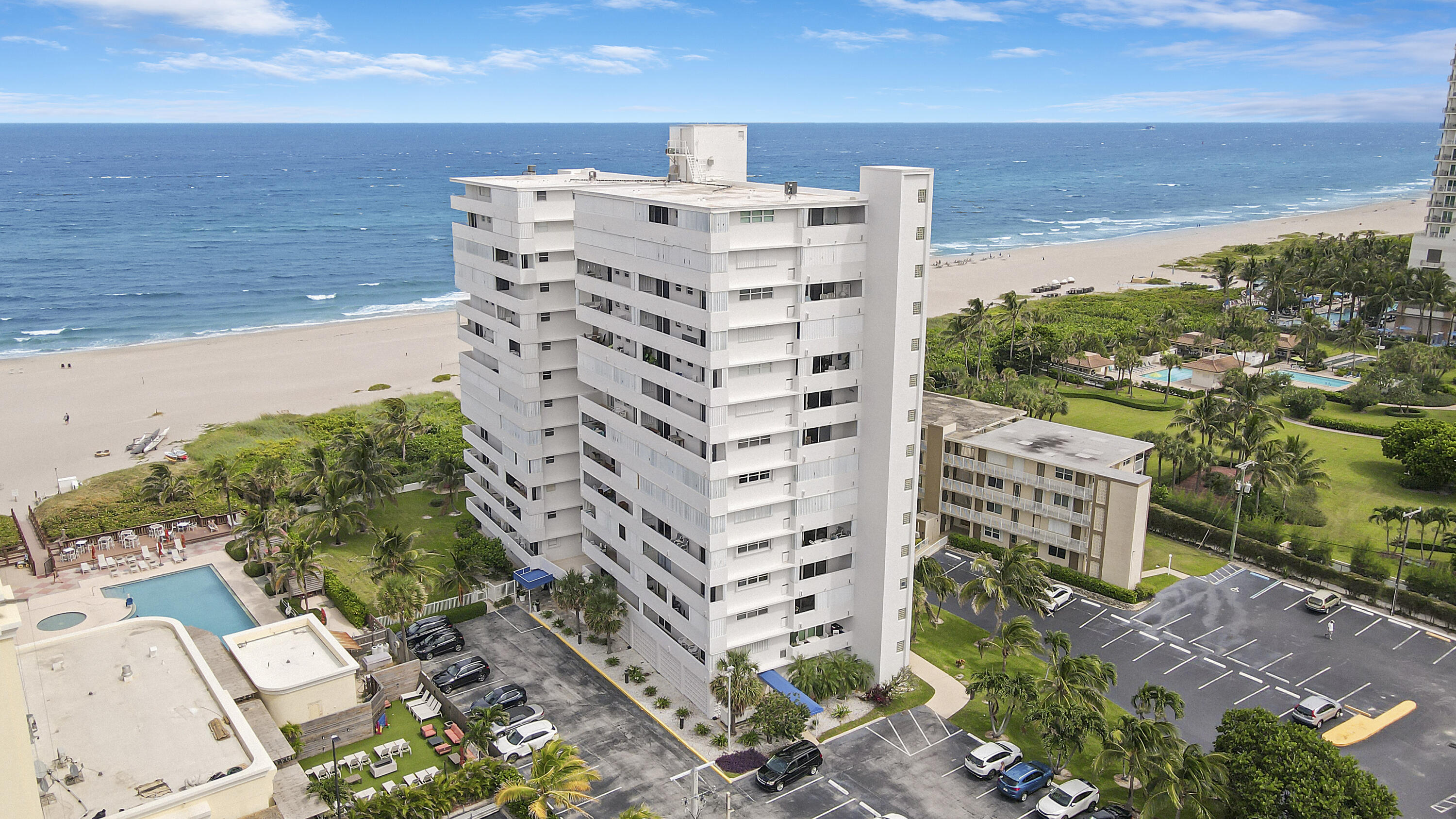 3640 North Ocean Drive, Unit 427 Singer Island, FL 33404 - Photo 2 of 43 a large building with a outdoor space