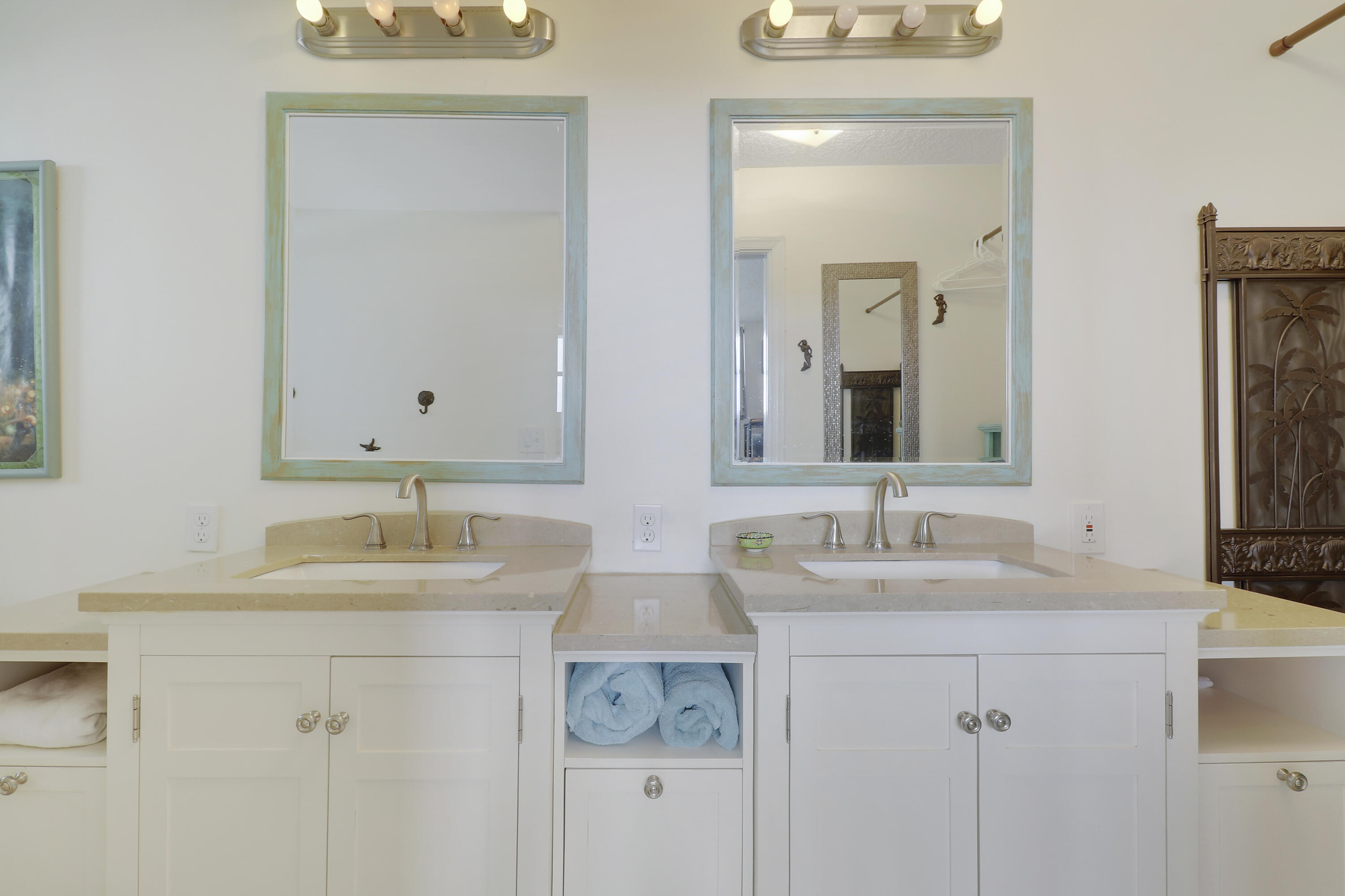 3640 North Ocean Drive, Unit 427 Singer Island, FL 33404 - Photo 23 of 43 a bathroom with double sink and a mirror
