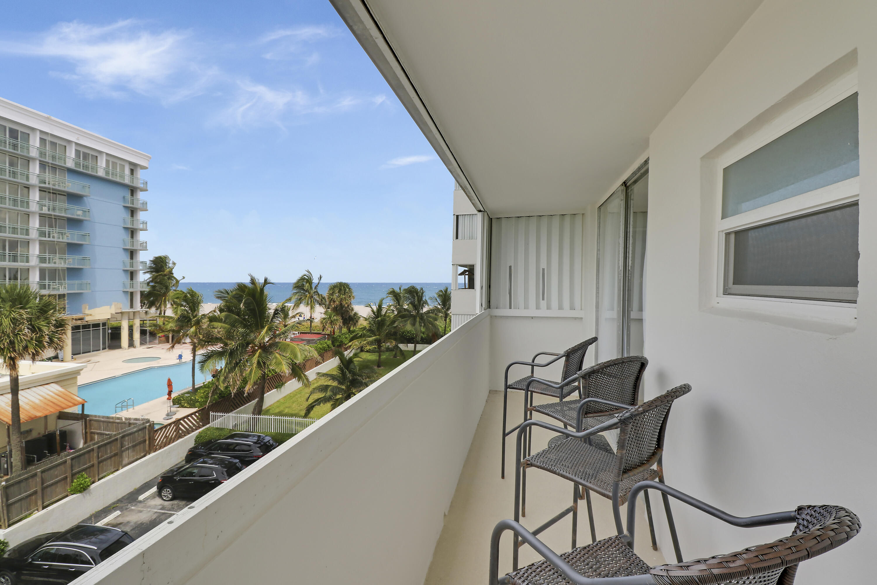 3640 North Ocean Drive, Unit 427 Singer Island, FL 33404 - Photo 25 of 43 a view of a balcony with chairs and table