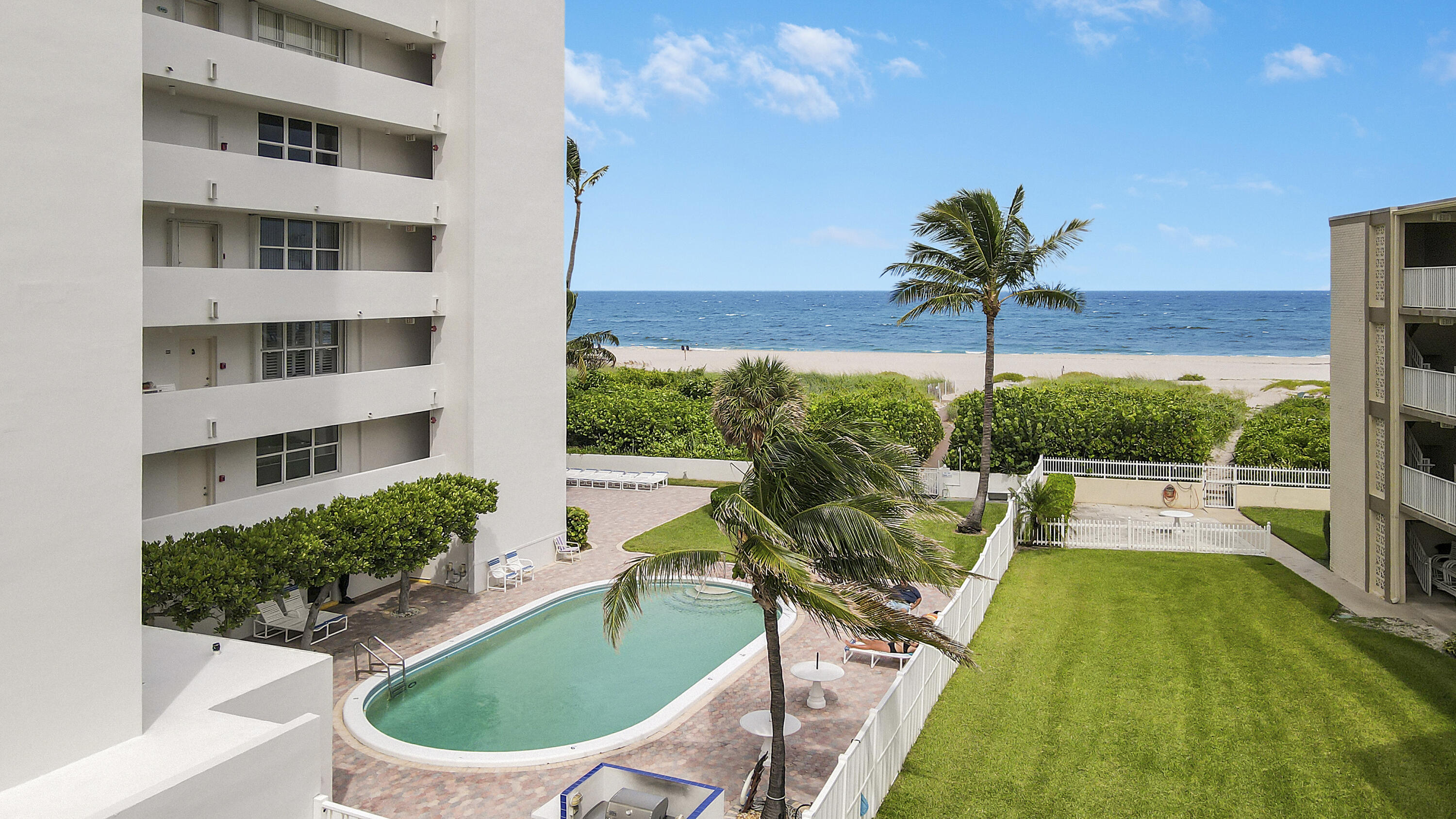 3640 North Ocean Drive, Unit 427 Singer Island, FL 33404 - Photo 29 of 43 a view of swimming pool with outdoor seating and plants