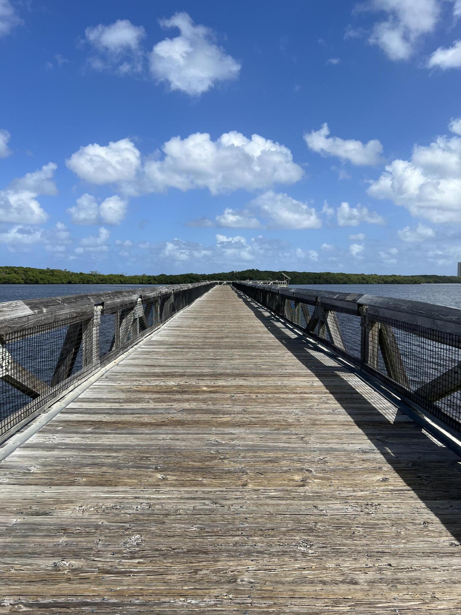 3640 North Ocean Drive, Unit 427 Singer Island, FL 33404 - Photo 40 of 43 a view of wooden balcony with two chairs