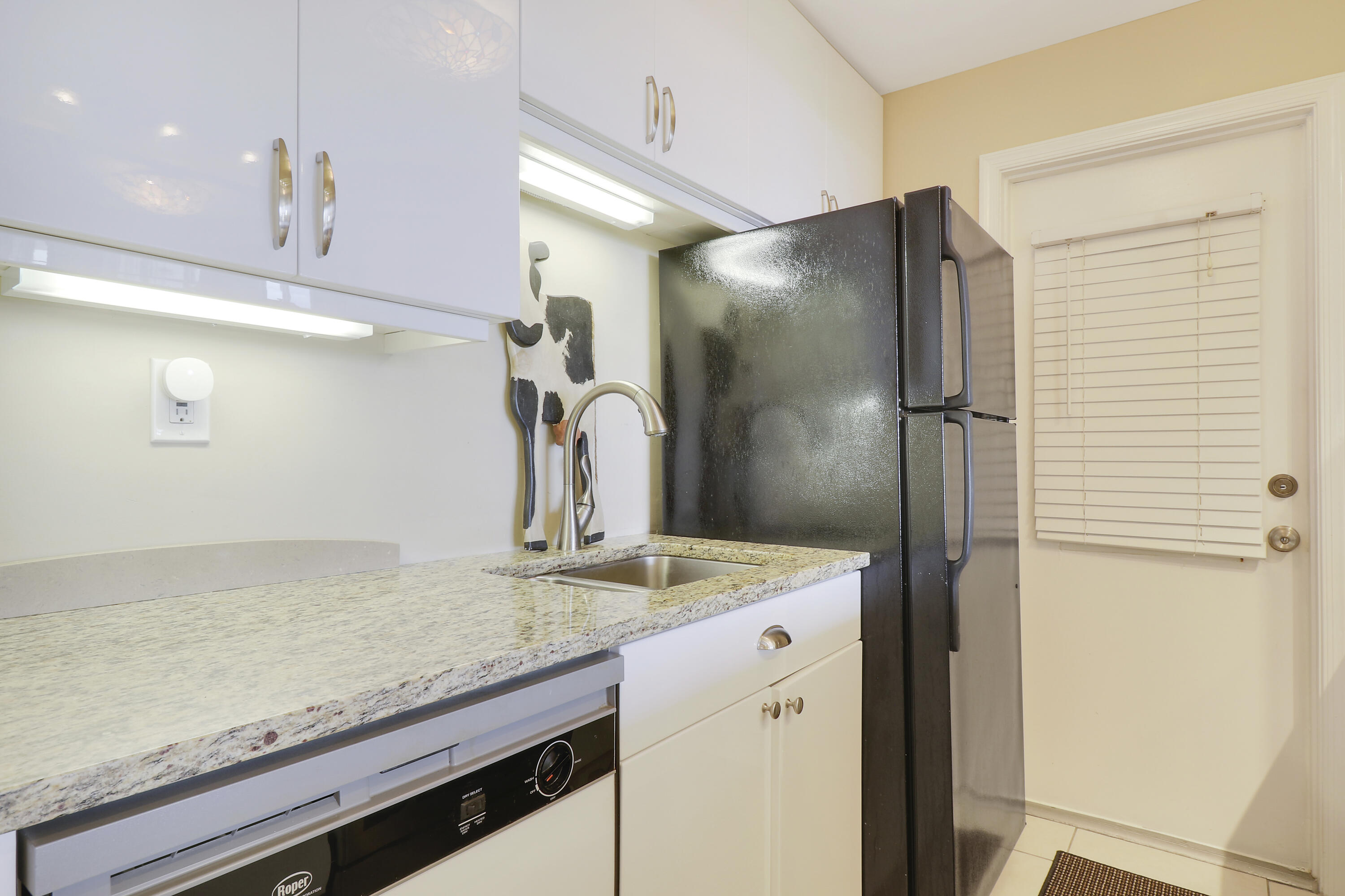 3640 North Ocean Drive, Unit 427 Singer Island, FL 33404 - Photo 10 of 43 a bathroom with a granite countertop sink a large mirror and shower