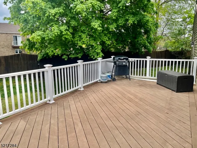 a balcony with view of a garden